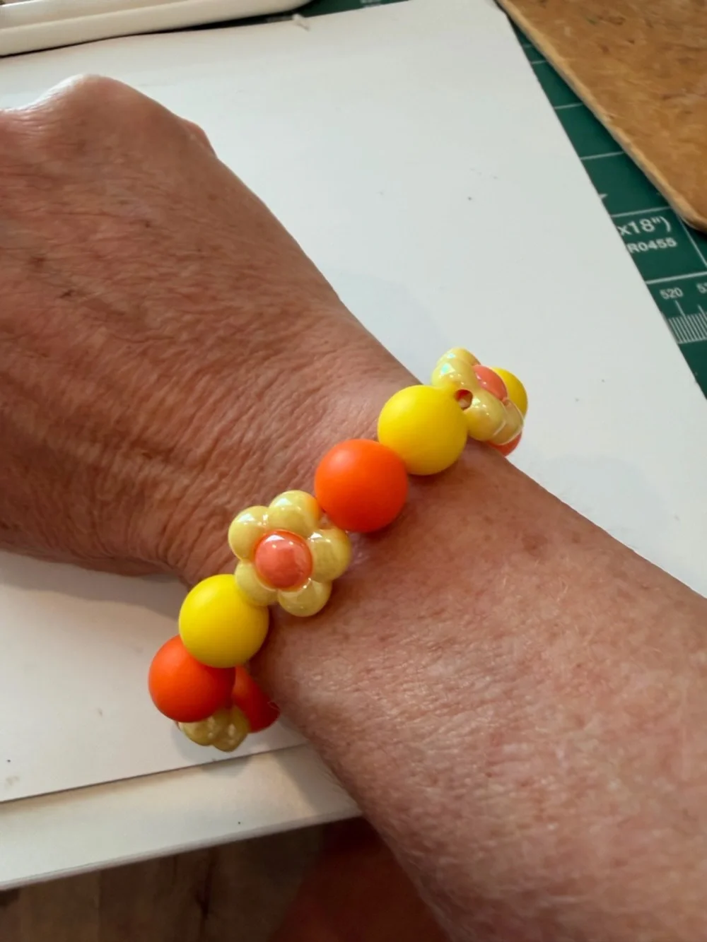 Hand Crafted Yellow and Orange Kids Flower Bead Stretch Bracelet - Picture 3 of 4